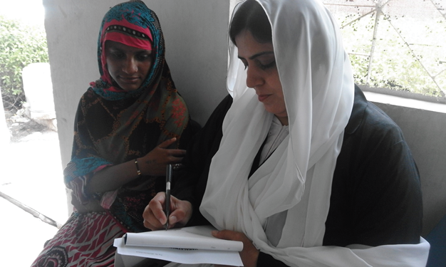 Legal aid caseworker consulting with a woman client